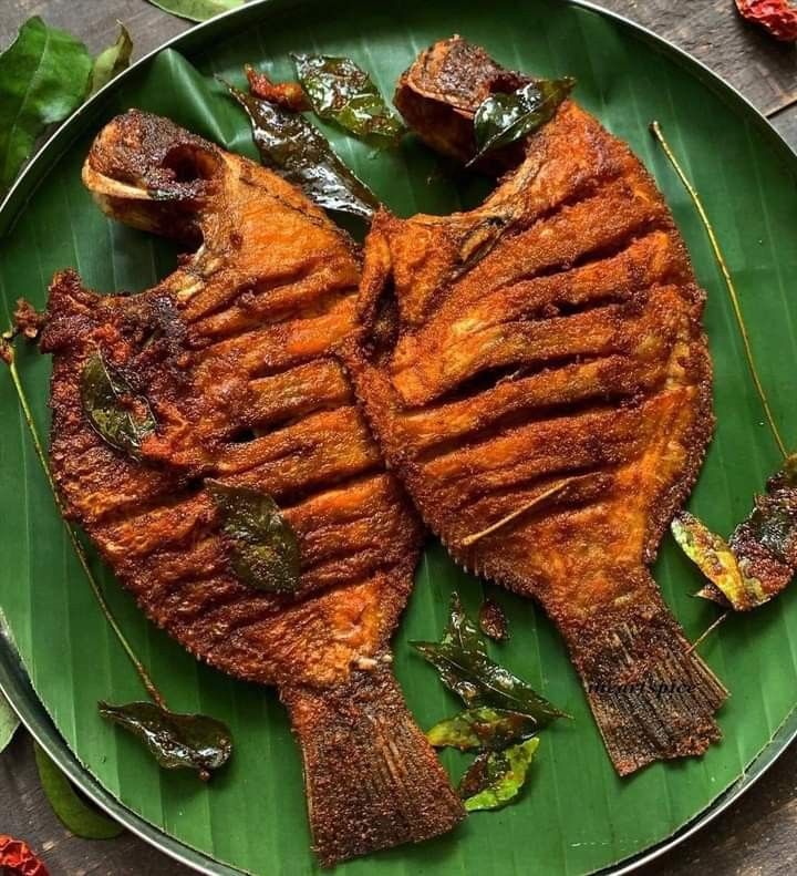 Malvani rava fried fish on a banana leaf